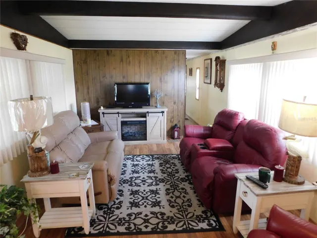 Living room is open with kitchen.