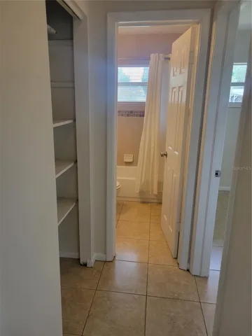 Hallway, linen closet and hall bathroom.