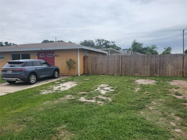 Wood fencing around 3 sides of the backyard. Vinyl fencing on the 4th side.
