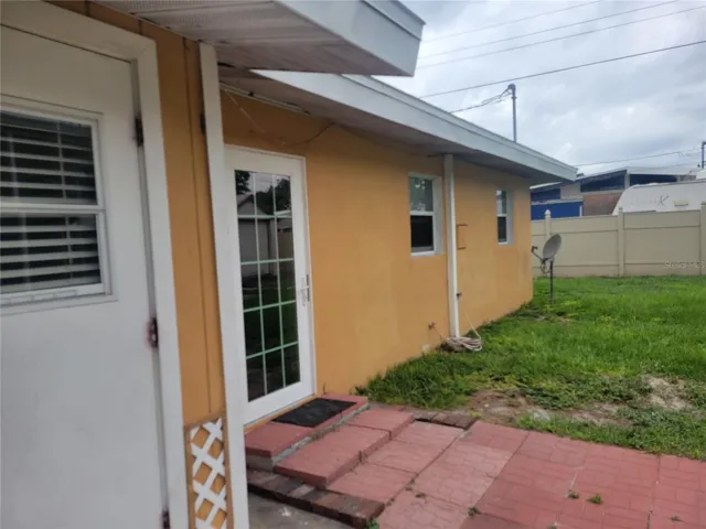 The near door is to the primary bedroom, the next door is to the dinette area.