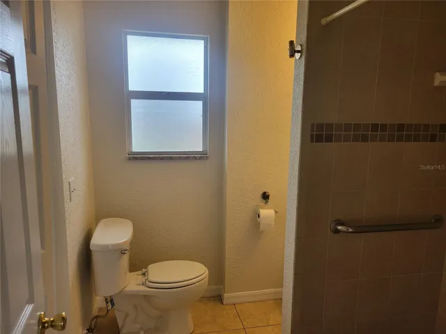 Primary bathroom offers a tiled walk-in shower..