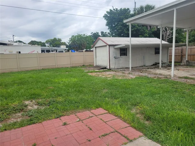 There is a very large, covered carport tall enough for an RV, large boat, and/or multiple vehicles.