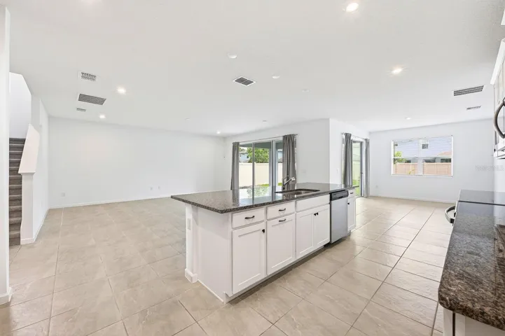Light, bright open concept living, dining and kitchen.