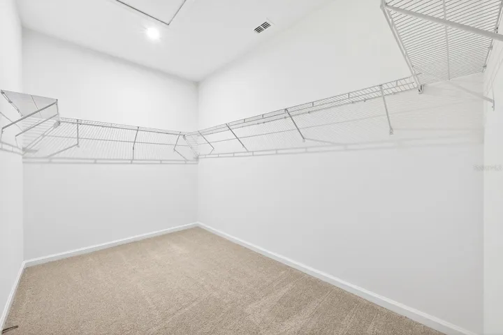 Huge primary suite walk-in closet.