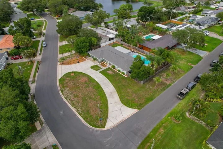 ENJOY THE CORNER OVERSIZED LOT!