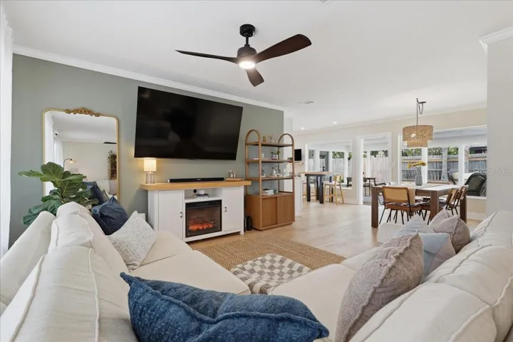 ABUNDANCE OF NATURAL LIGHT SHINING THROUGH THE OPEN FLOOR PLAN