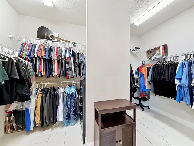 Walk in closet in primary bedroom