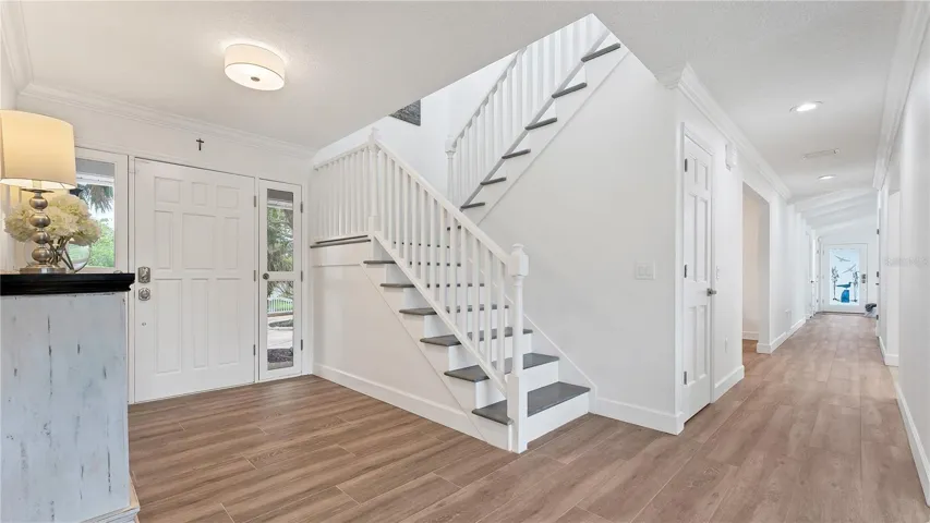 Entry looking down hallway to kitchen, dining and living room