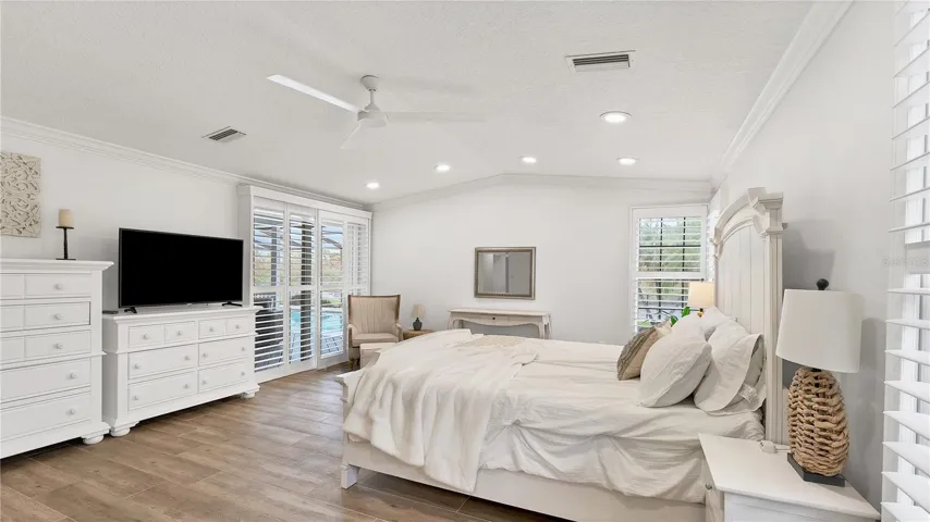Primary suite with sliding doors to pool area.