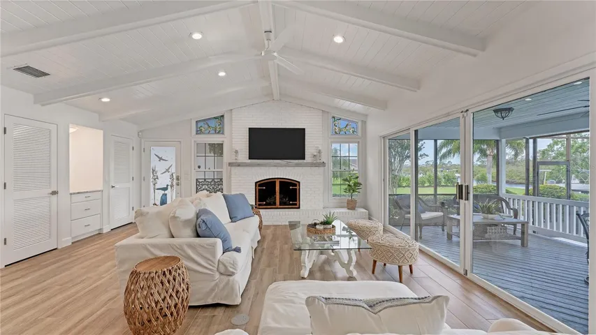 Living room with sliders to pool/waterfront