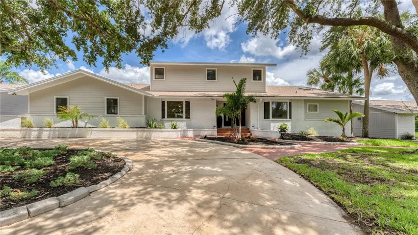 Circle driveway into front of 2 story home