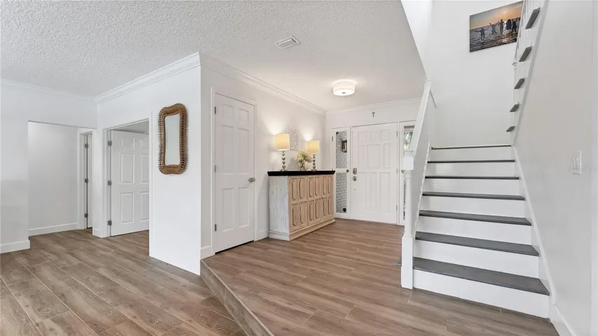 Front entryway with staircase to 2nd level