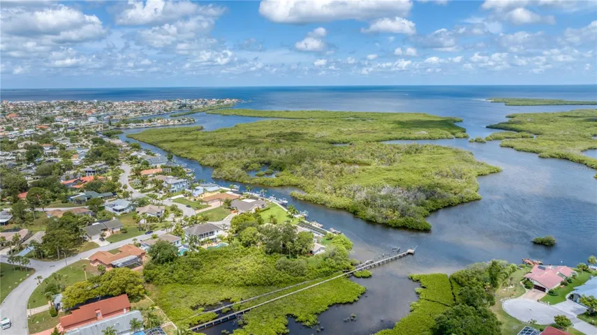 Aerial view of property looking West towards Gulf with deep channel access