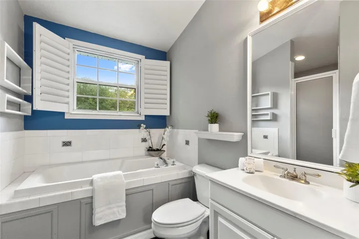 Primary bathroom vanity and tub