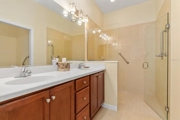Dual sinks in primary bath.  No step into shower.  Equiped with grab bars for safety.