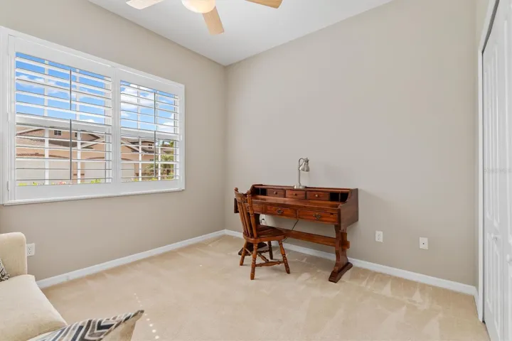 Front bedroom with lots of light. Plantations shutters. Currently has pull out double bed sofa, desk and bookcase.  All convey.Sofa is like new.