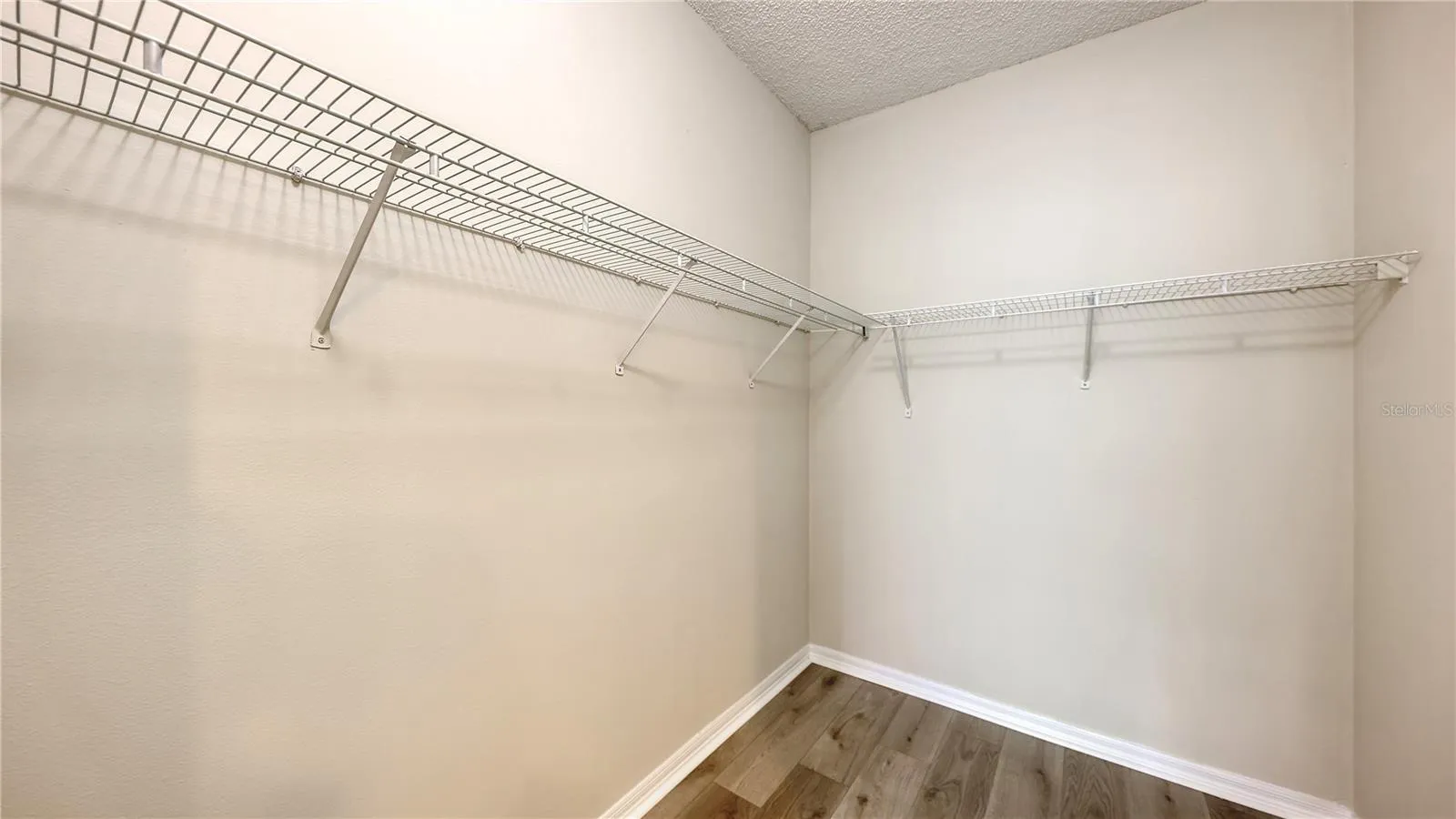 Spacious walk-in closet in the primary bedroom