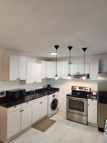 Open concept white modern kitchen cabinets