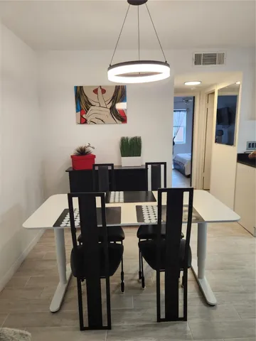 OPen concept dining area with room for dining table.