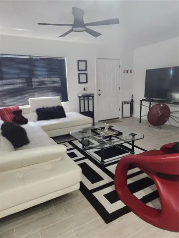Open concept living, dining & kitchen with new tile floors throughout