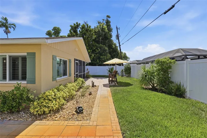 sidewalk alongside the house.