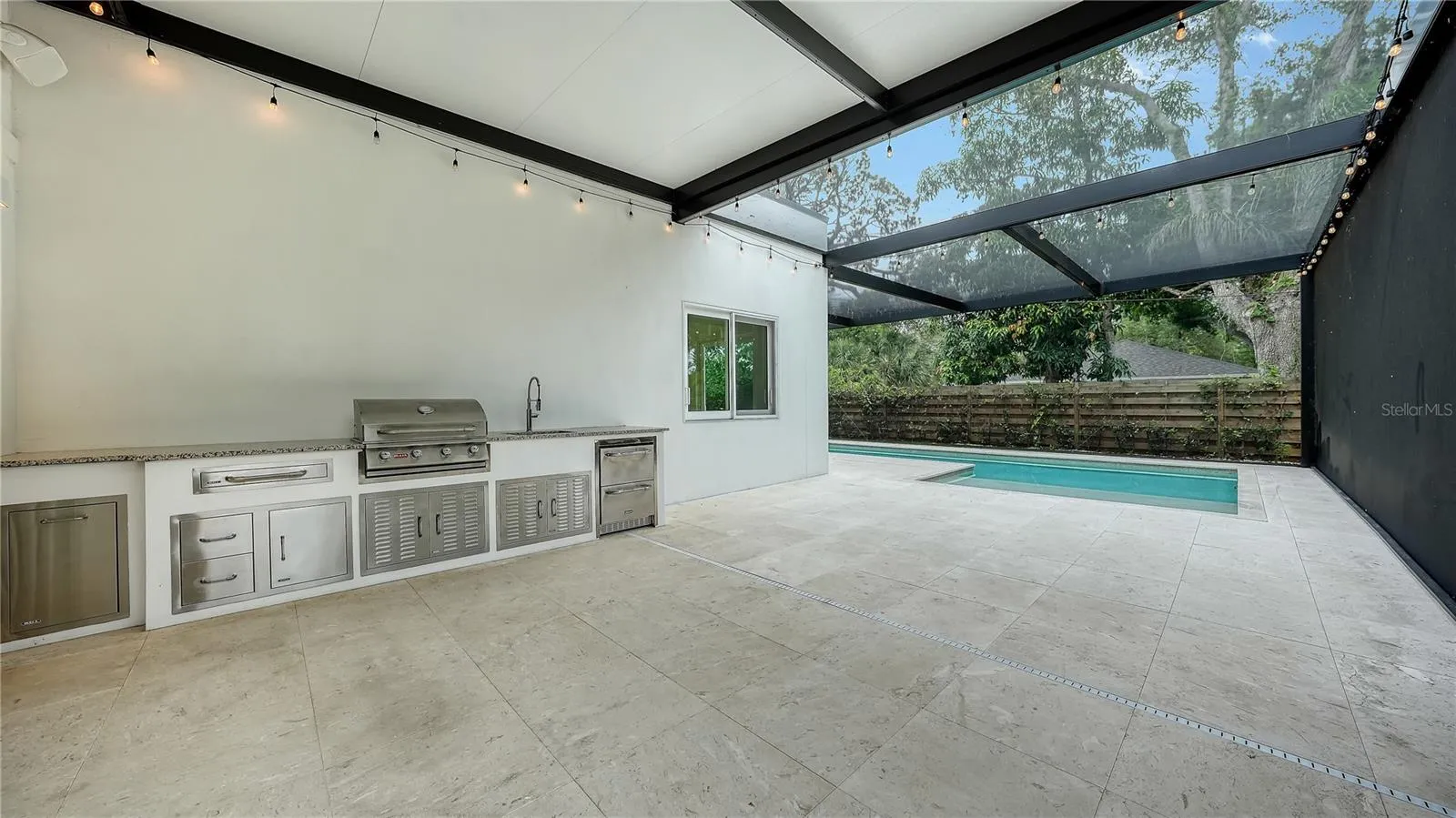 Full outdoor kitchen with fridge