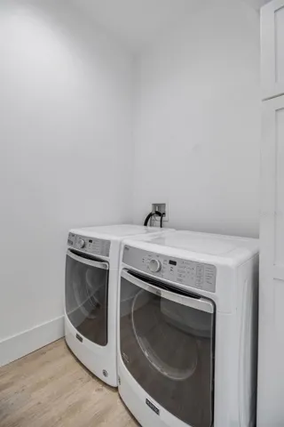 Generously sized laundry room designed for convenience