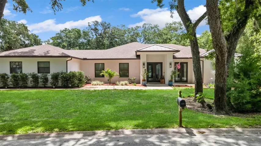 Nestled on a beautifully manicured acre of park-like grounds.