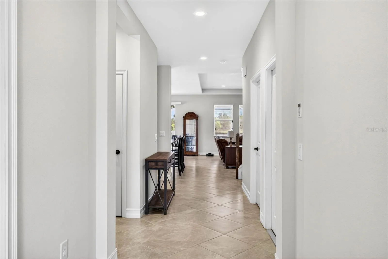 Bright and open entryway with high ceilings.
