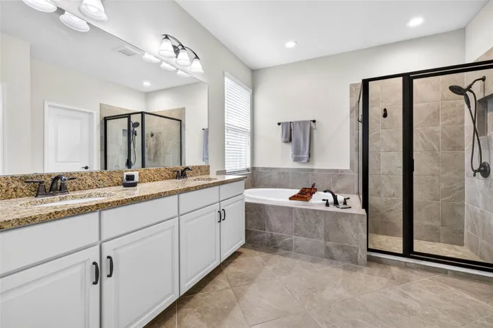 First floor full bath in the primary suite