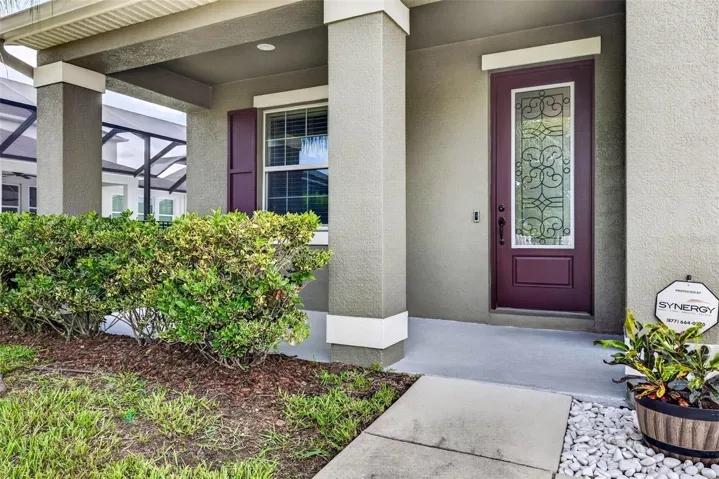 Front porch with glass door and abundant light.