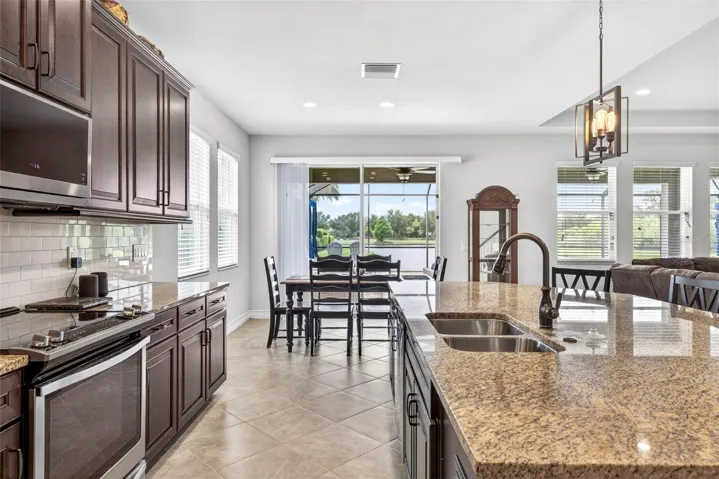 Stainless steel appliances & a view toward the dining area.