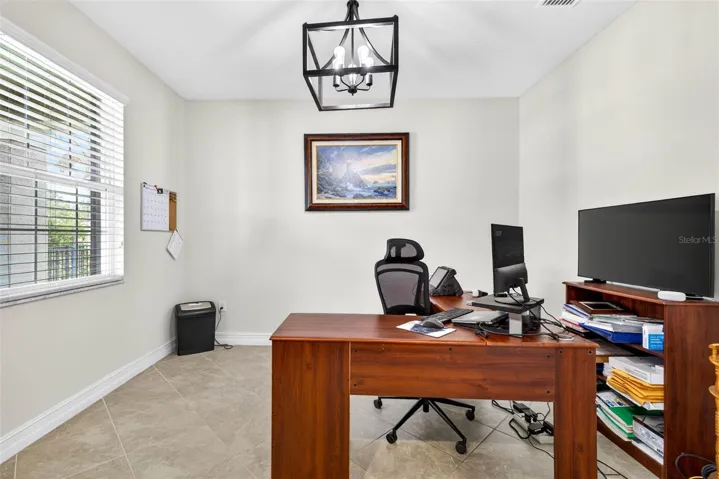 First floor office by the entryway.  Doors added for privacy.