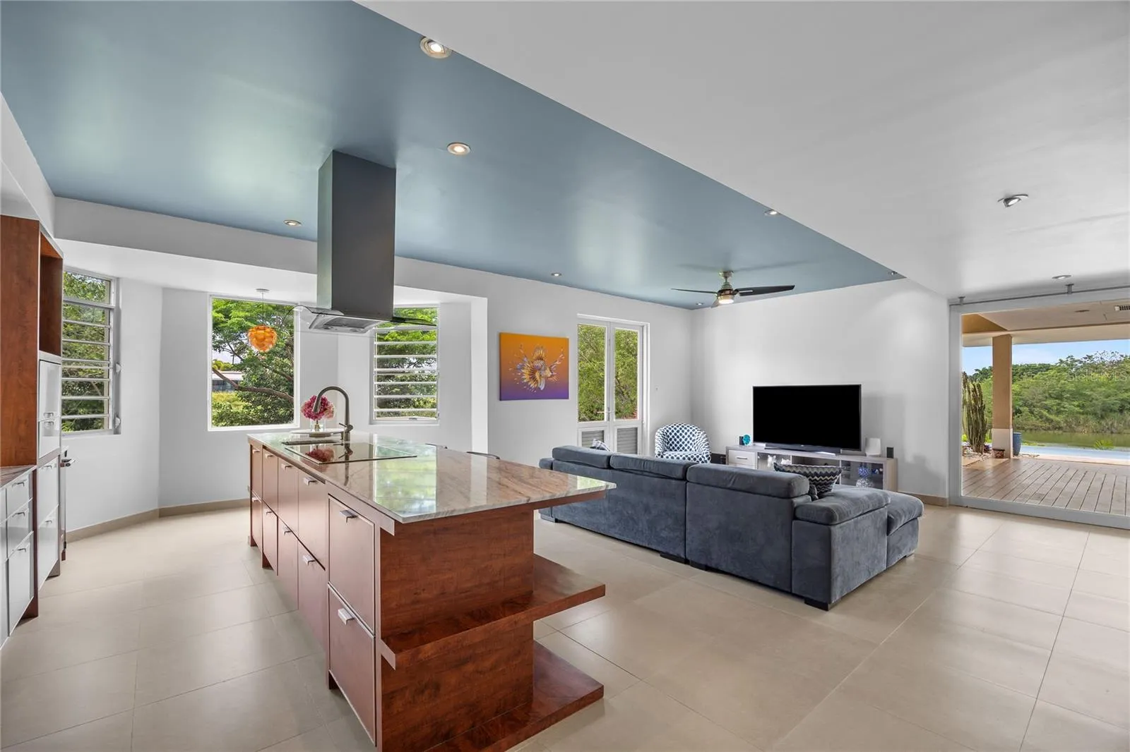 At the heart of the home, the kitchen opens effortlessly to the family room and den, creating a warm and functional gathering space. An expanded pantry offers valuable additional storage and enhances everyday convenience.