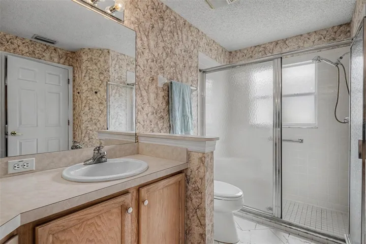 Step-in shower with built-in seating