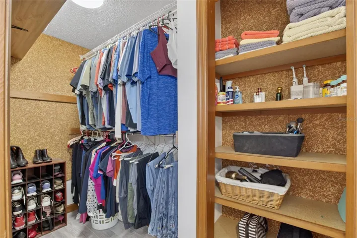 Downstairs primary walk in closet