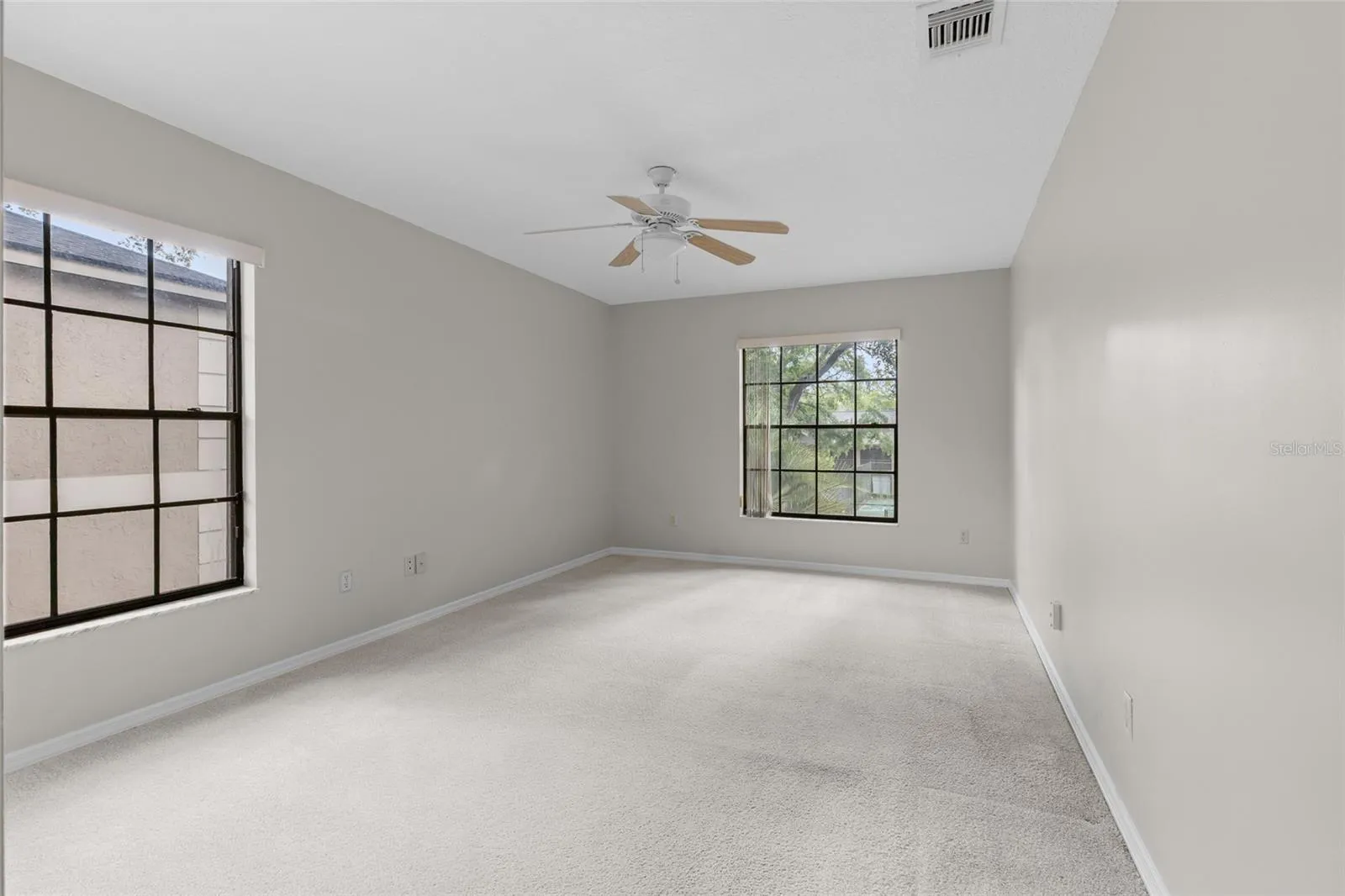 Guest bedroom 3 has newly painted walls and new textured ceiling