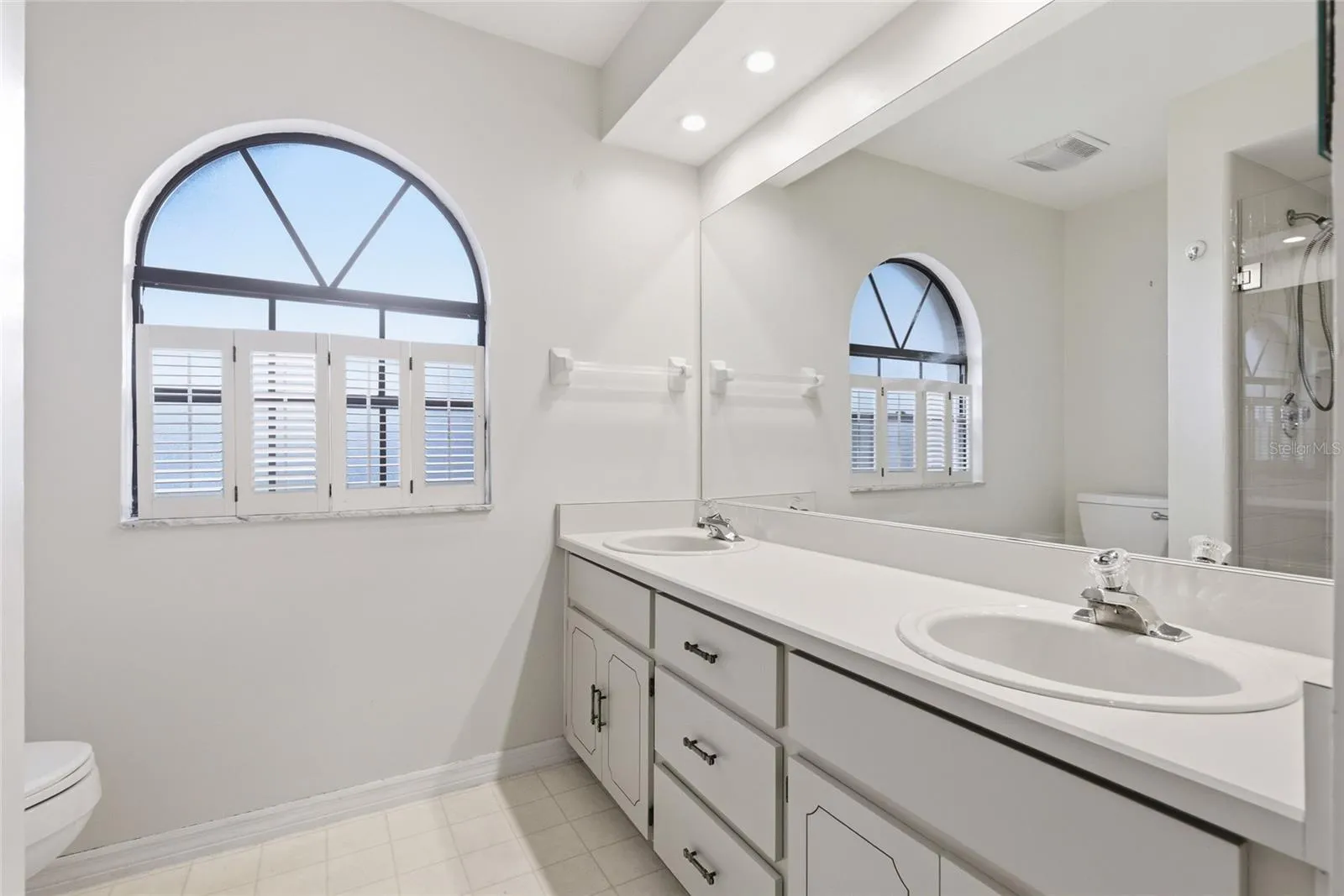 Primary bathroom has dual sinks, garden tub and shower.