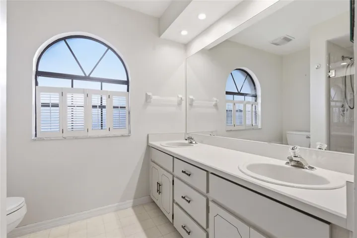 Primary bathroom has dual sinks, garden tub and shower.