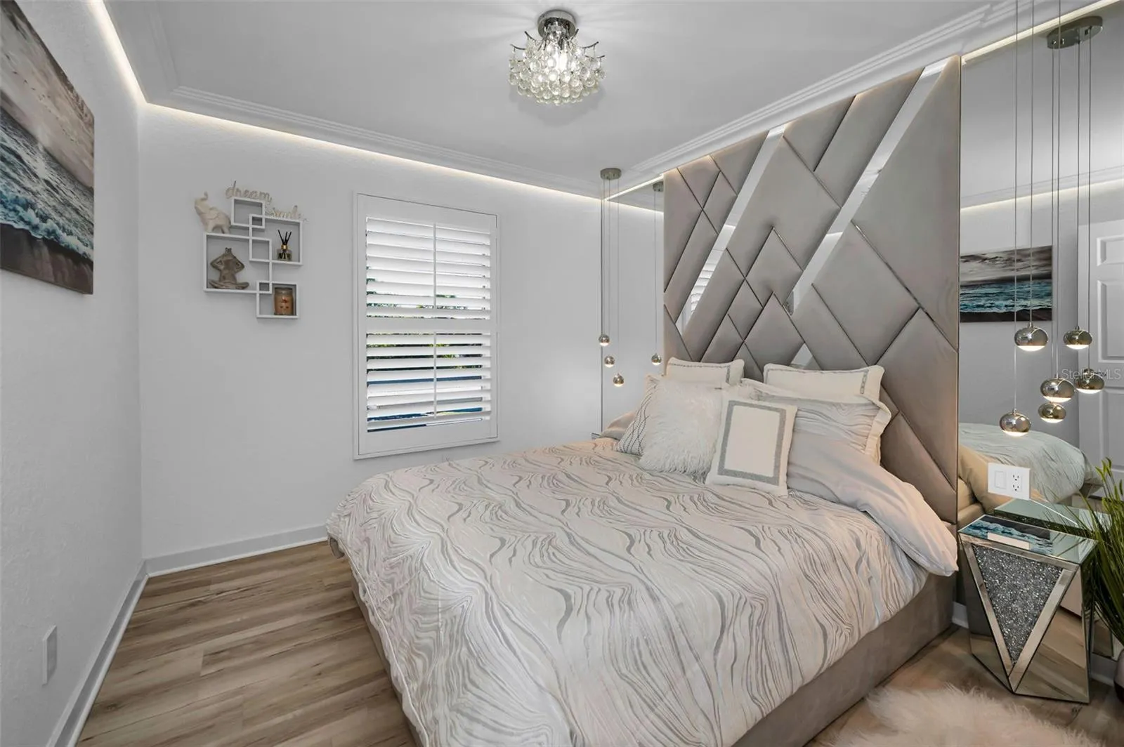 2nd bedroom, custom built in headboard and lighting.