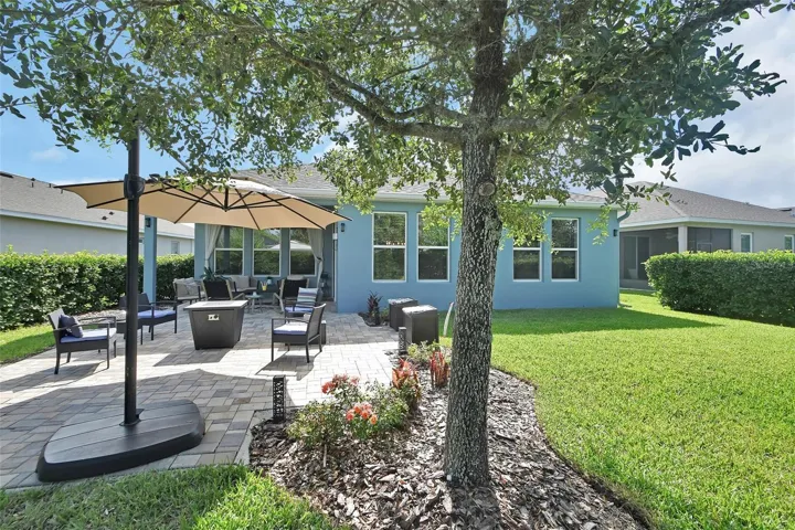 Fenced backyard with privacy landscaping