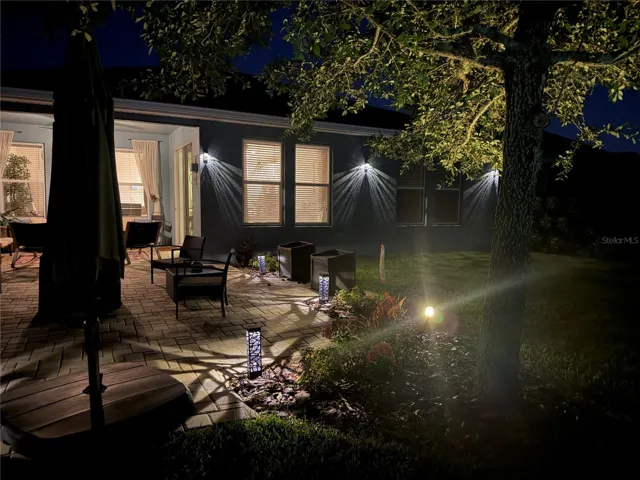 Night view of patio and landscape lighting