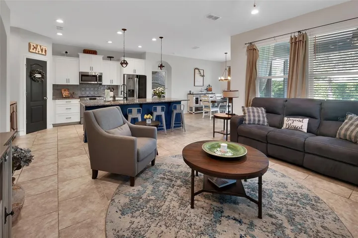 Spacious living area with recessed lighting
