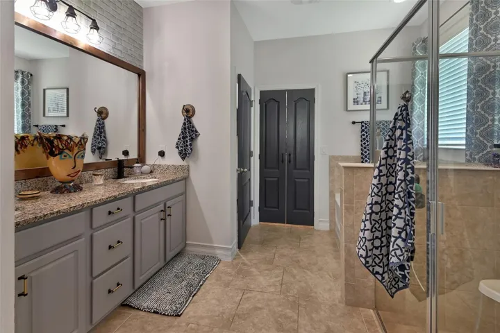 Dual sink vanity with extra drawers and shelving