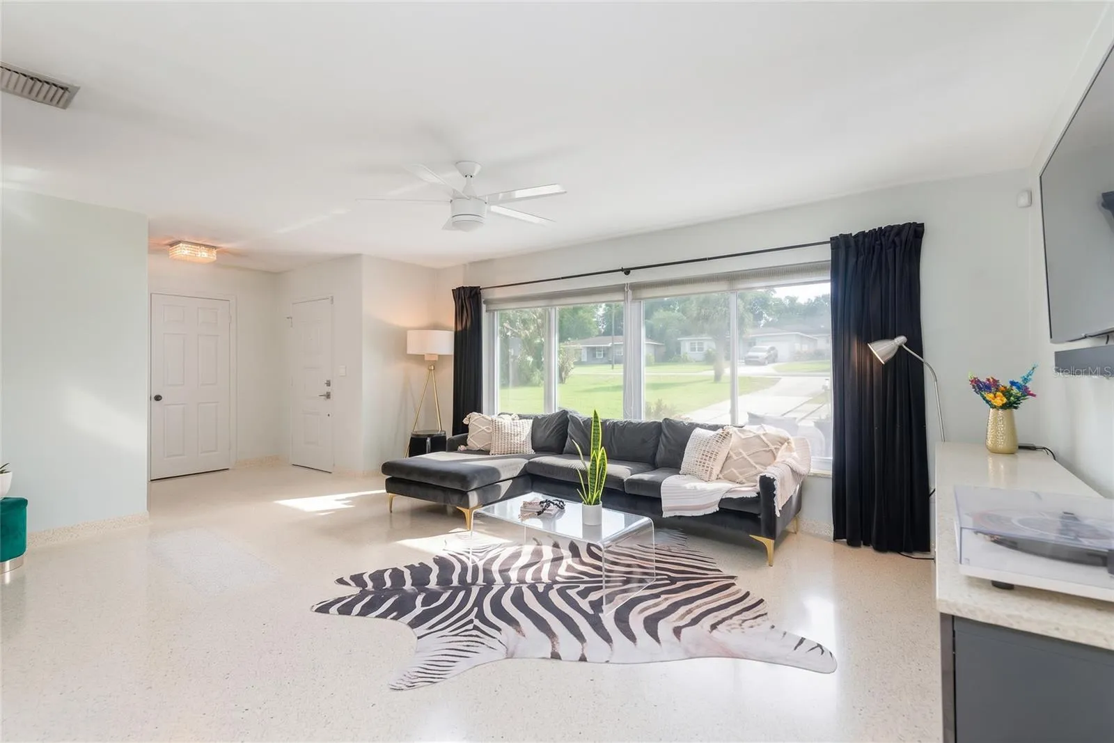 Custom poured terrazzo flooring (including base boards) flow throughout the home. Ready to compliment your decor no matter the style or color palette.