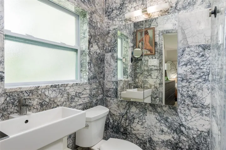 Primary Bathroom with exotic Milas Lilac Marble