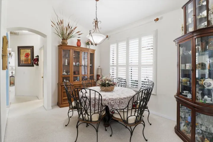 Formal Dining Room w/ Plantation Shutters... Guest Hallway on Left