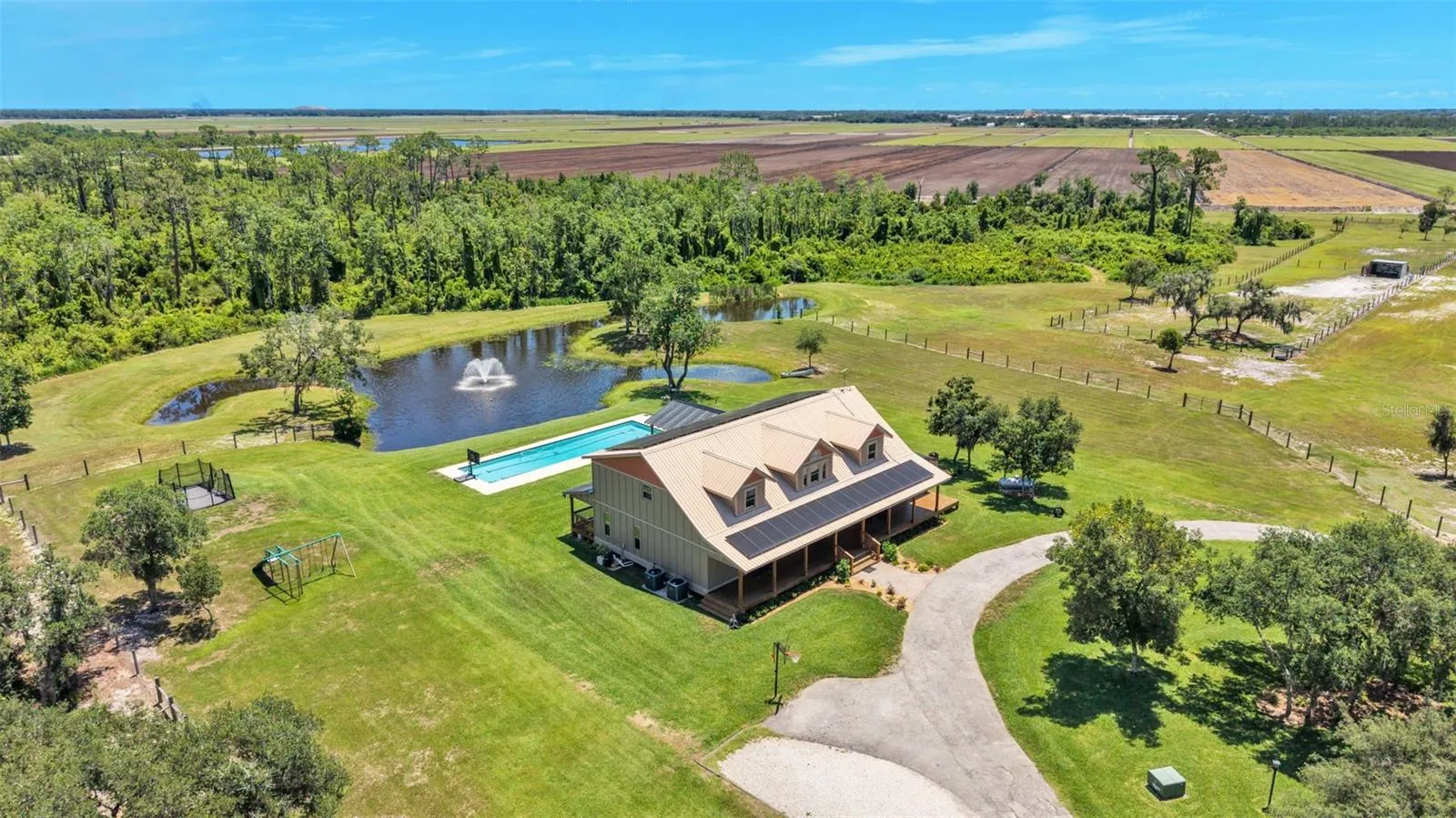 Overhead View of House, Pool, Pond, Property