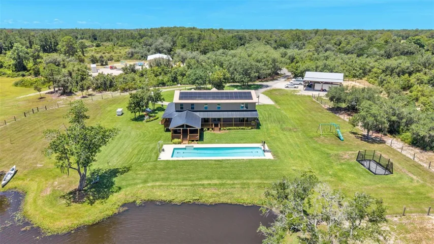 Overhead View of House, Pool, Pond, Property