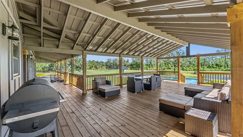 Back Wrap Around Porch that Extends to the Pool